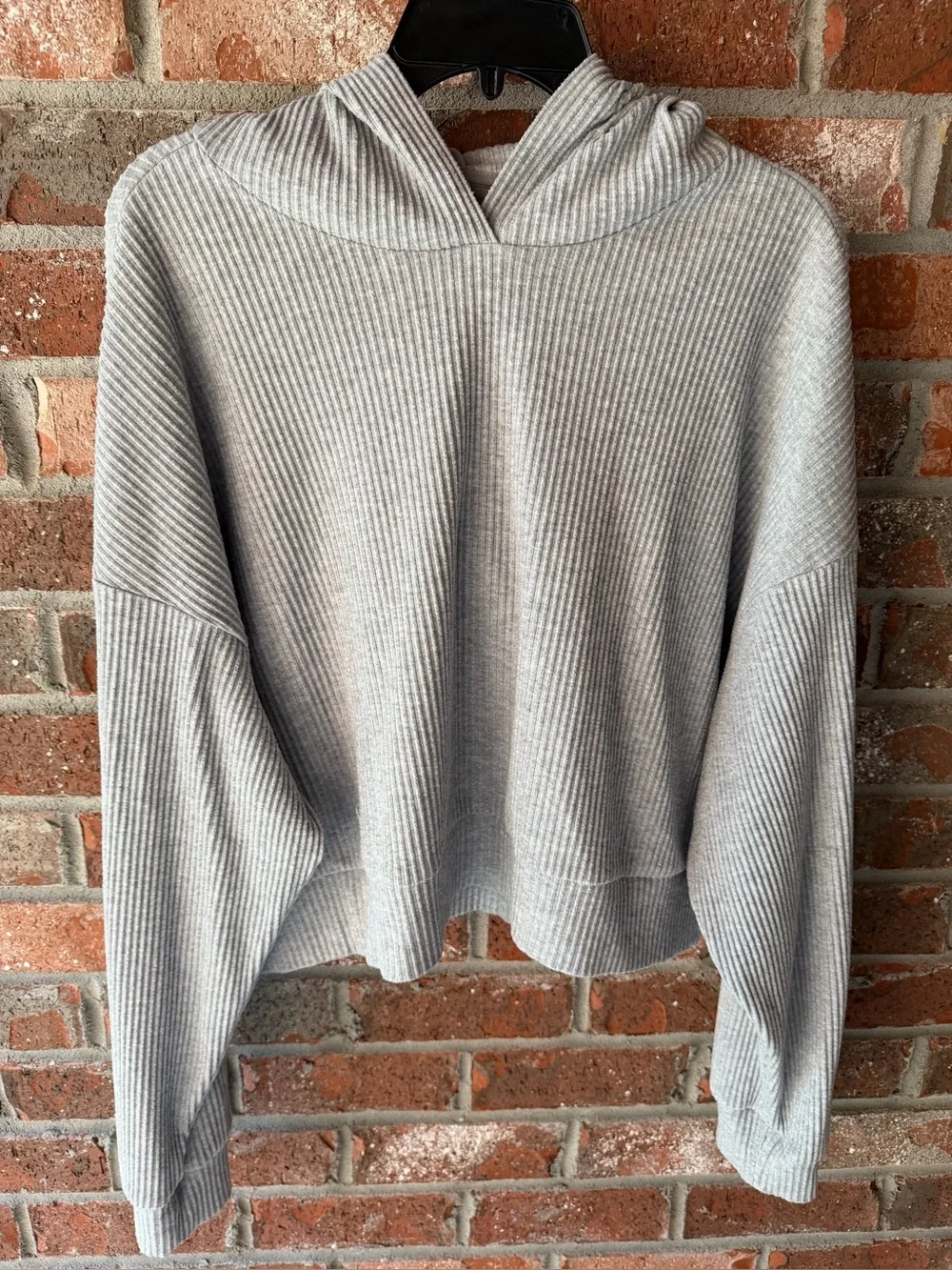 Alo Yoga Muse Hoodie in the color Athletic Heather Grey. Size large